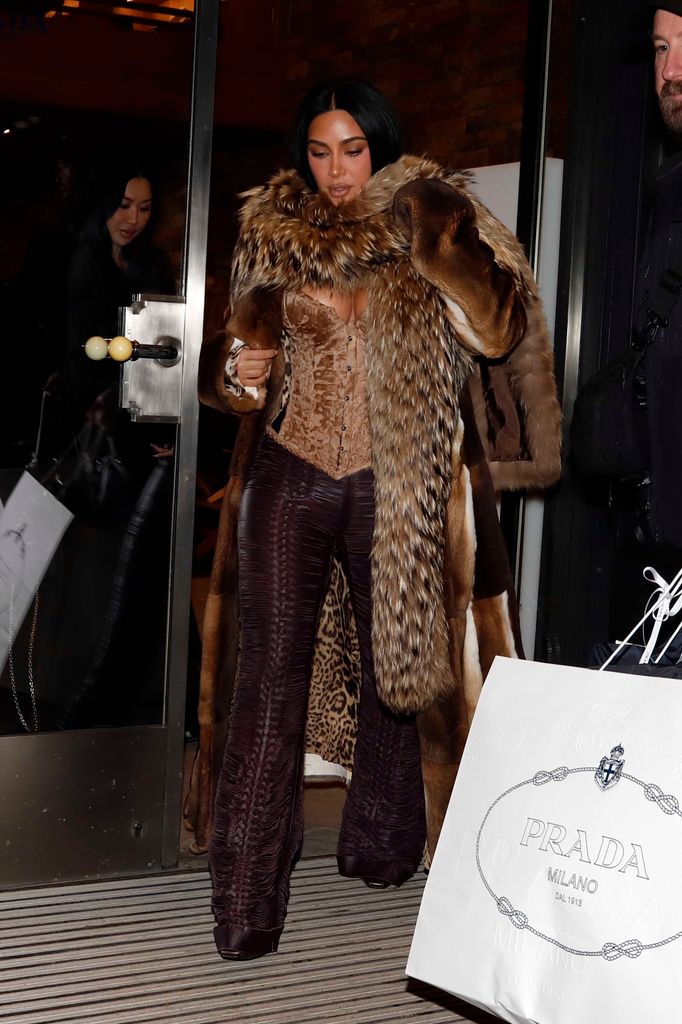 Kim Kardashian leaving prada in fur coat 