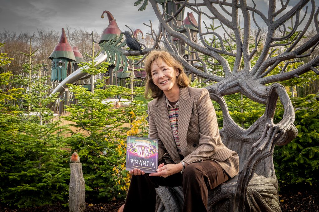 Duchess of Northumberland posing with her new book