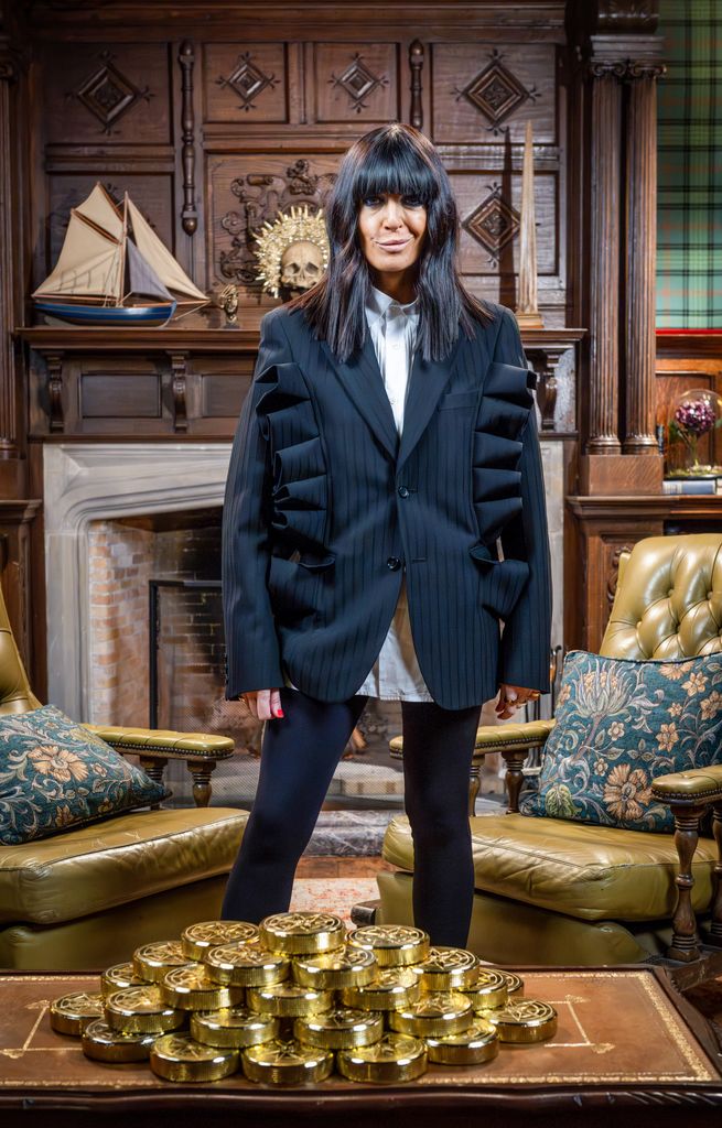 Claudia Winkleman wearing Comme des Garçons pinstripe blazer on The Celebrity Traitors final