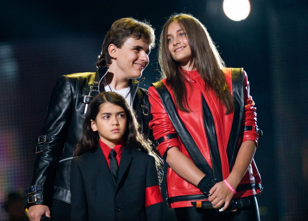CARDIFF, WALES - OCTOBER 8:  (L-R) Prince Michael Jackson, Blanket Jackson and Paris Jackson appear on stage at the Michael Forever Tribute Concert in memory of the late Michael Jackson at the Millennium Stadium on October 8, 2011 in Cardiff, Wales. (Photo by Samir Hussein/WireImage)