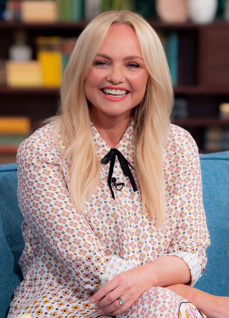 Emma Bunton smiling in a flowery dress