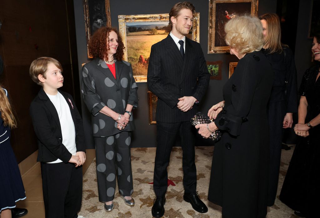 Queen Camilla speaks with author Maggie O'Farrell, Joe Alwyn and Jacobi Jupe 