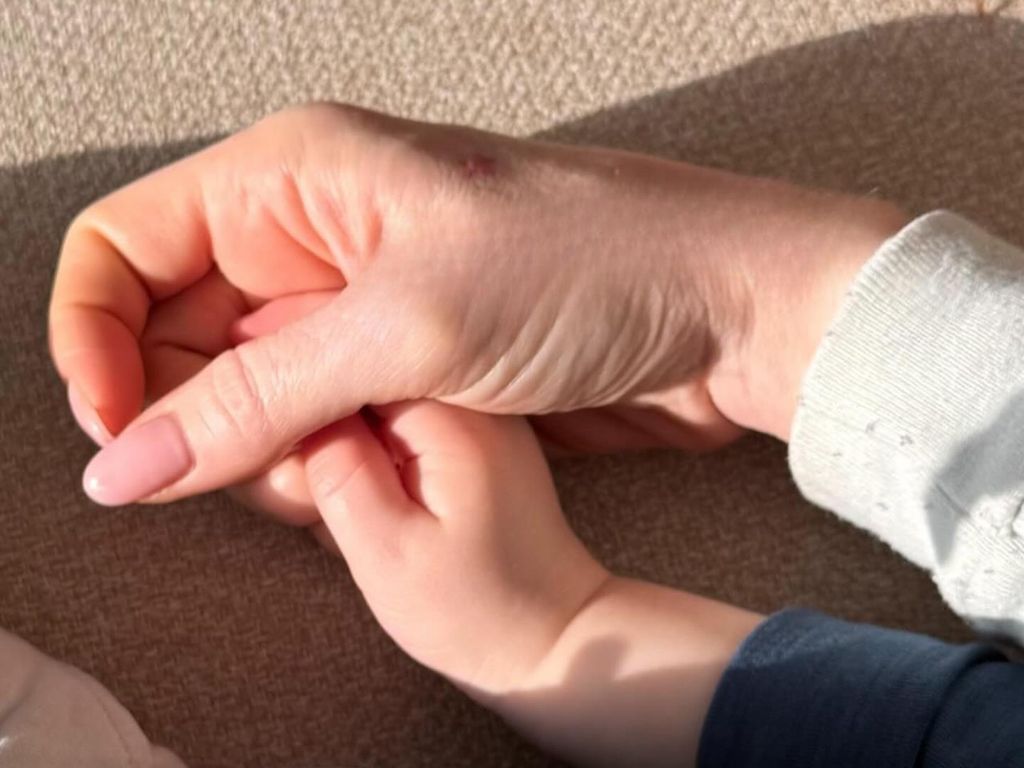 lindsay lohan hand holding sons hand