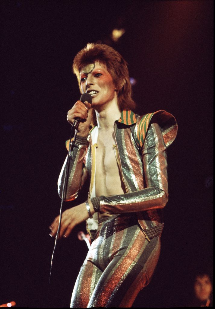 David Bowie performs on stage as Ziggy Stardust