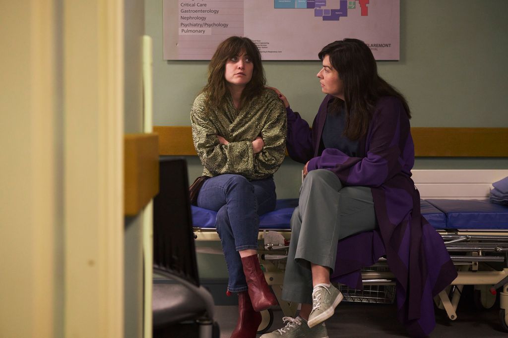 two women sitting in hospital waiting room