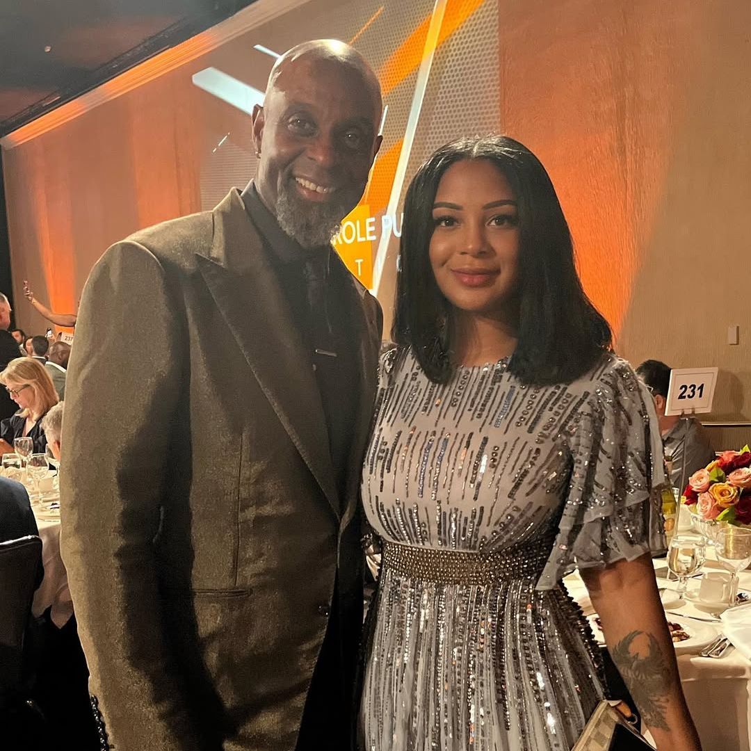 Jerry Rice poses for a picture with his daughter Jaqui Rice Gold at a gala, shared on Instagram