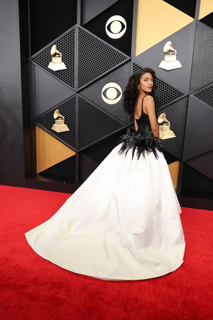 Olivia Dean in a black and white backless gown at the Grammys