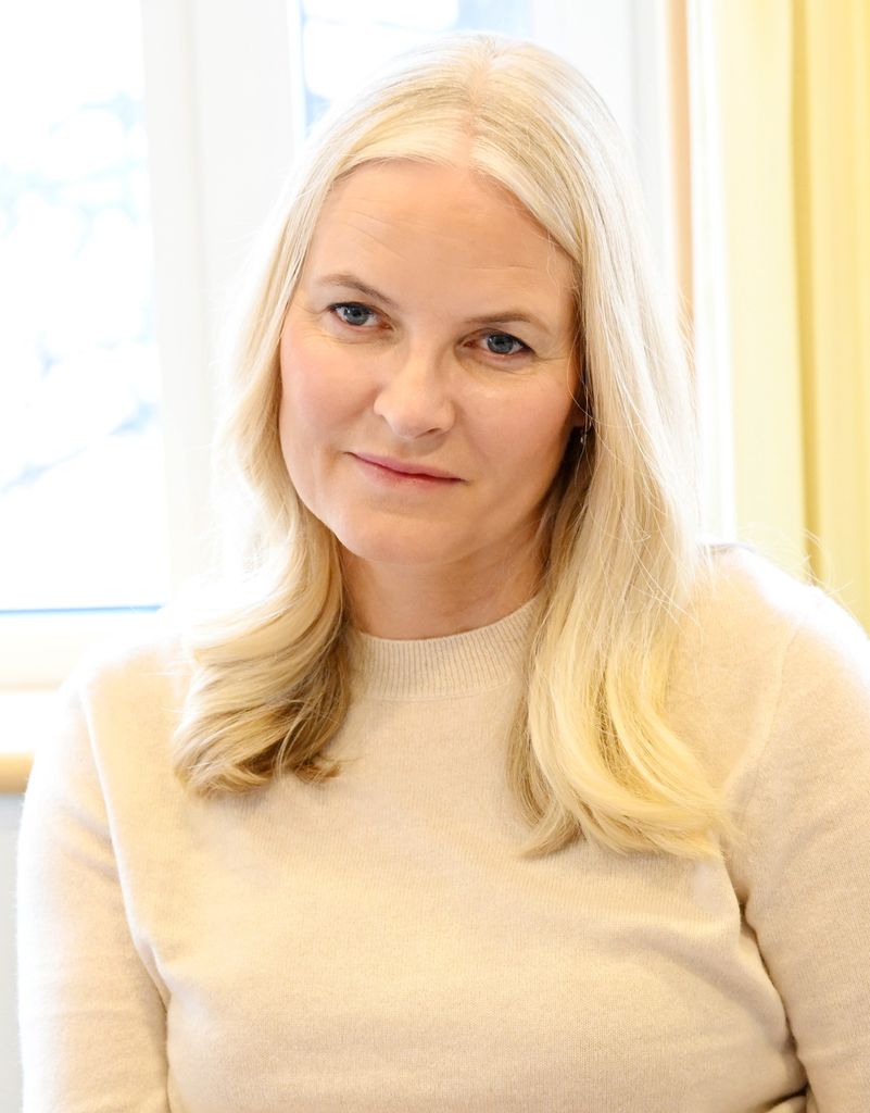 Crown Princess Mette-Marit looking serious in cream jumper