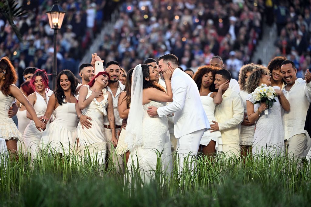 Performers portray a wedding during Puerto Rican singer Bad Bunny performance at Super Bowl LX Patriots vs Seahawks Apple Music Halftime Show at Levi's Stadium in Santa Clara, California on February 8, 2026