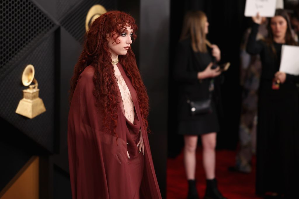 Chappell's glamorous cloak covered her revealing gown