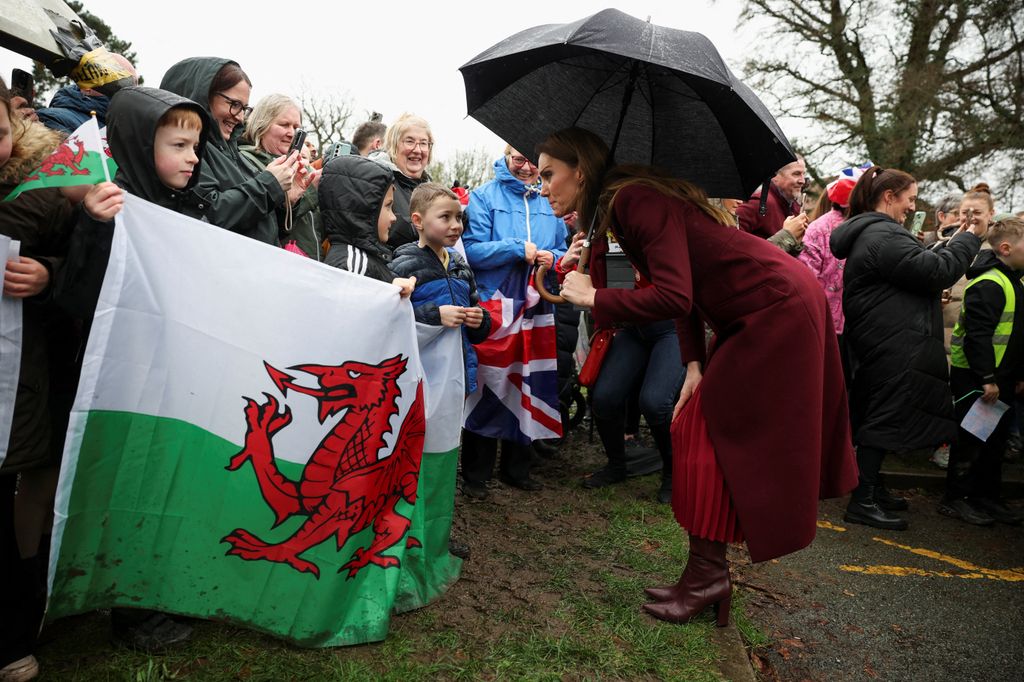 Kate Middleton talking to a group of children