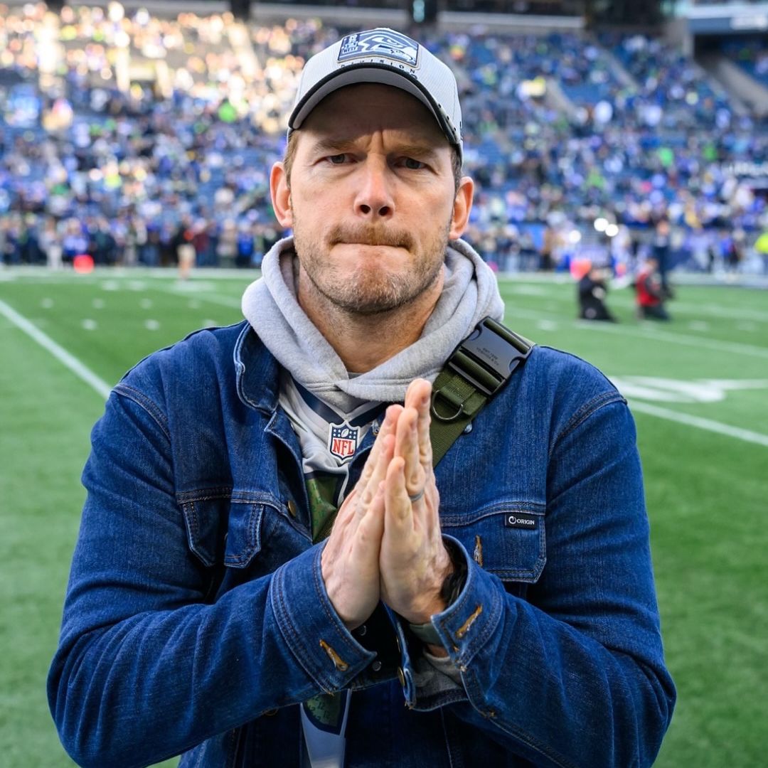 Chris Pratt stands on the field ahead of Super Bowl LX