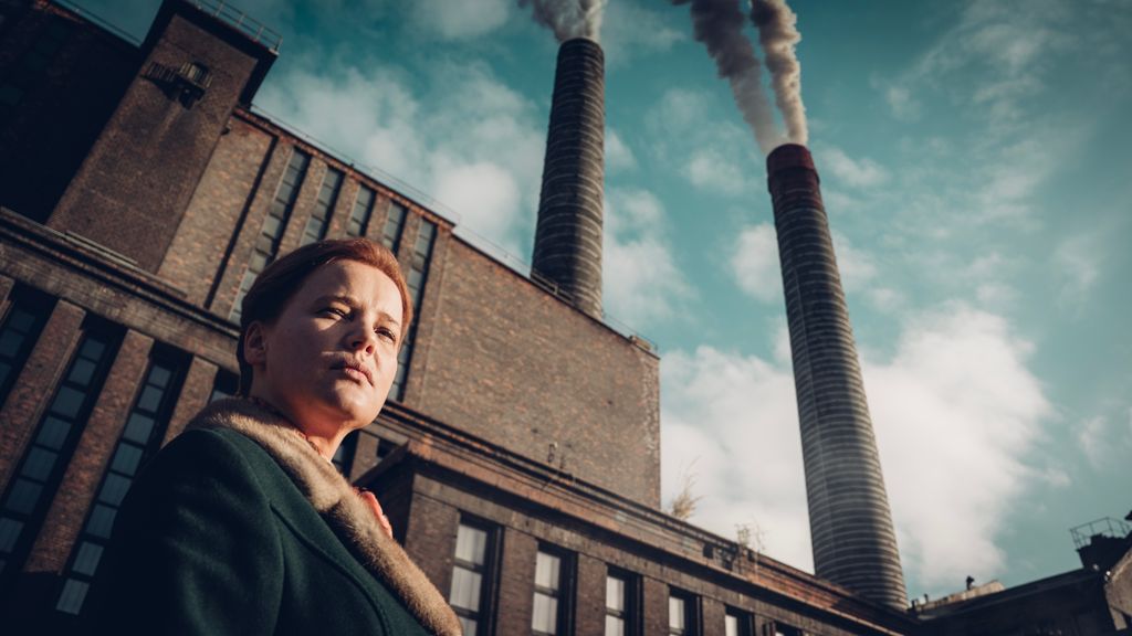 Joanna Kulig standing outside a factory in a still from Lead Children