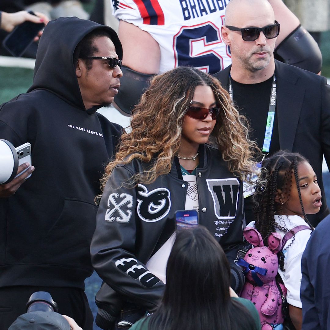 US rapper Jay-Z with his daughters Blue Ivy Carter and  Rumi Carter (R) attend Super Bowl LX between the New England Patriots and the Seattle Seahawks at Levi's Stadium in Santa Clara, California on February 8, 2026.