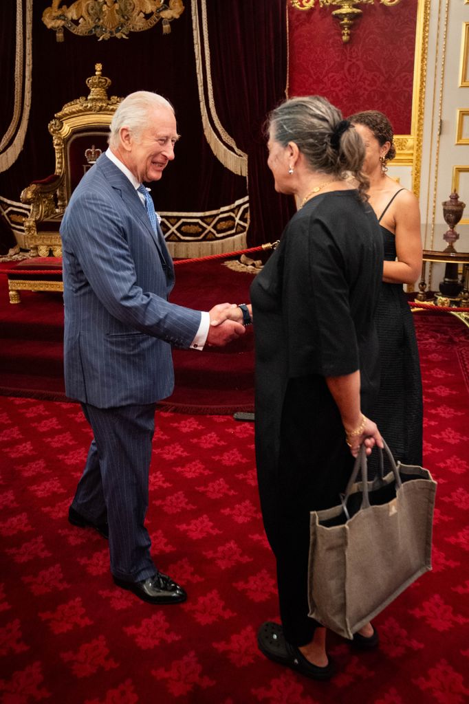 King Charles shaking hands with Tracey Emin