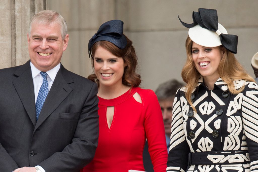 Andrew Mountbatten-Windsor stands next to daughters Eugenie and Beatrice.