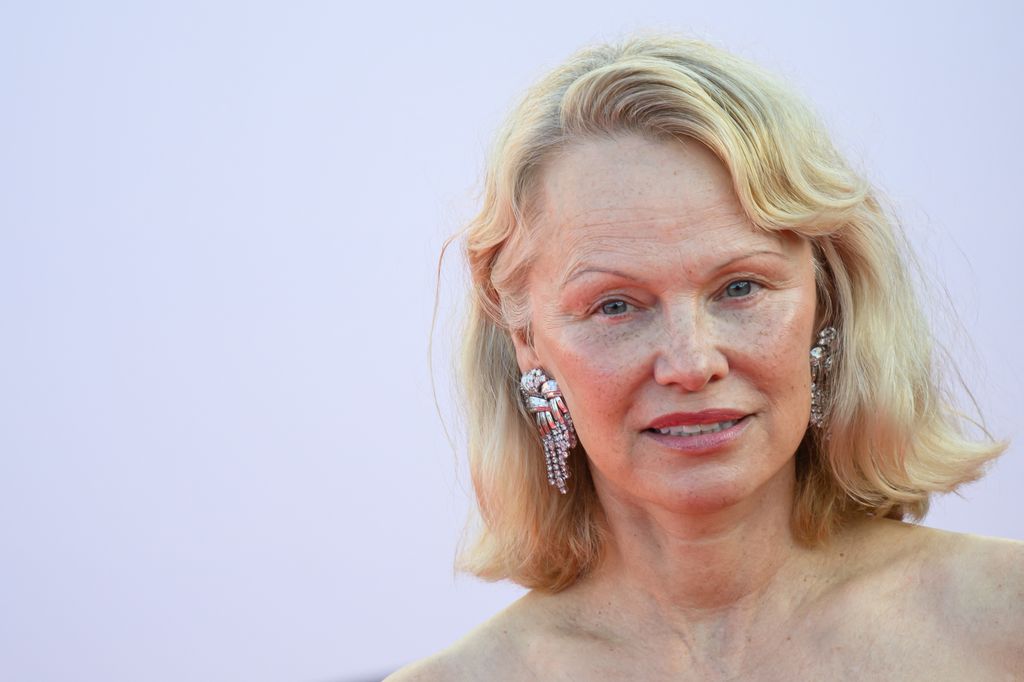 Pamela Anderson poses on the red carpet as she arrives to be awarded the Deauville Talent Award prize during the opening ceremony of the 51st edition of the Deauville American film festival, in Deauville, northwestern France, on September 5, 2025. (Photo by Loic VENANCE / AFP) (Photo by LOIC VENANCE/AFP via Getty Images)          
