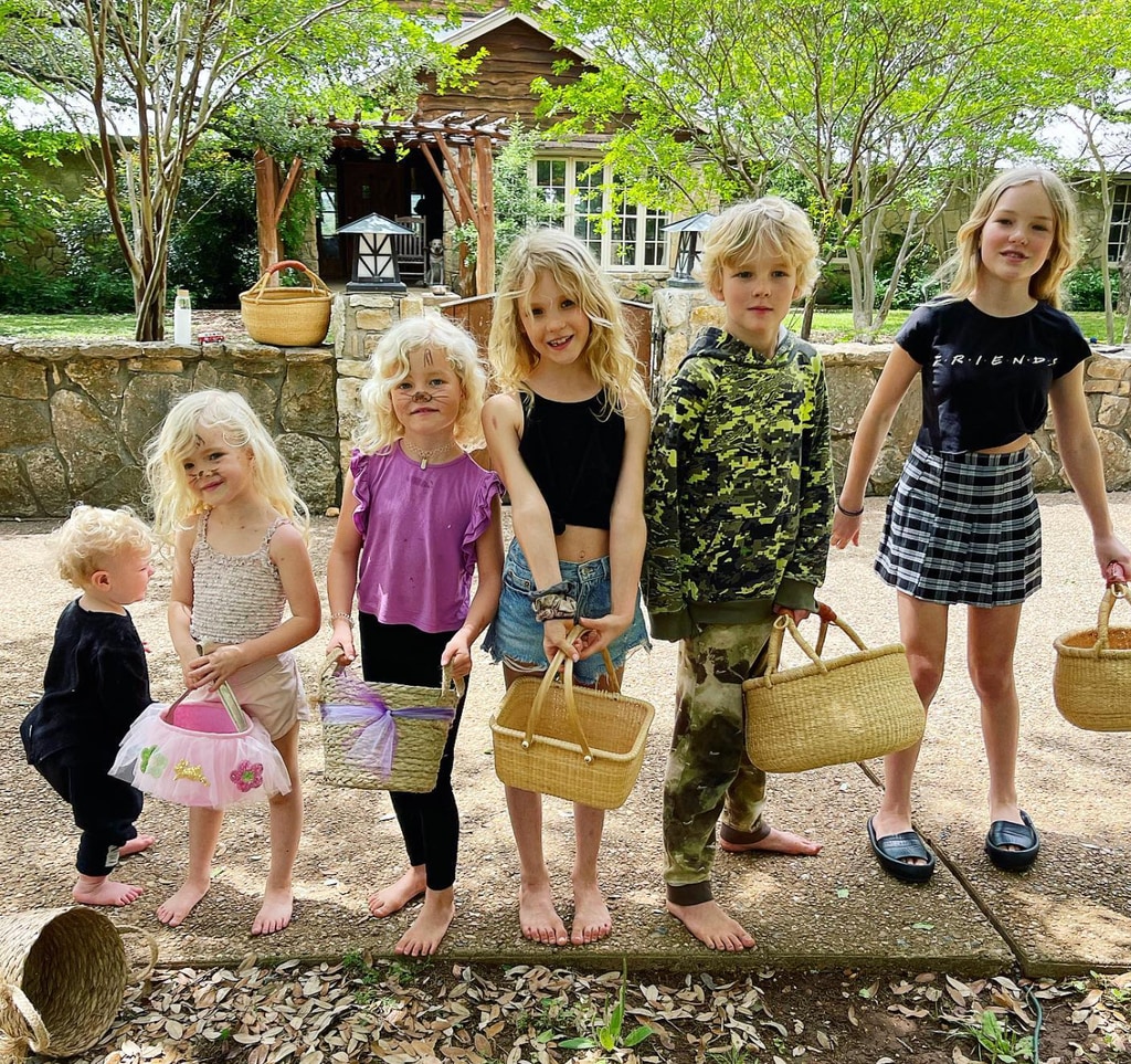 children lined up with baskets 