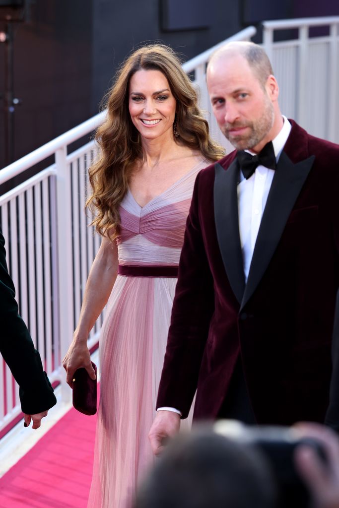 Catherine, Princess of Wales in mauve gown and Prince William on red carpet in suit