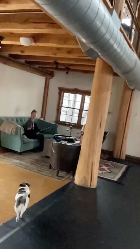 living area with wooden beams 