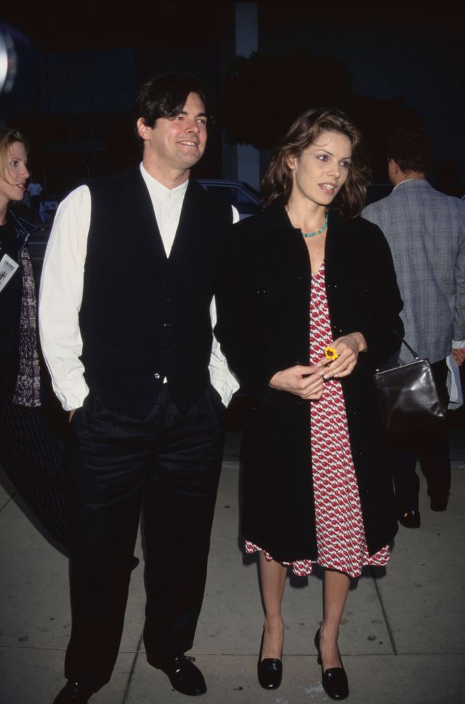Damon Welch wears a black waistcoat and stands next to his sister Tahnee Welch.