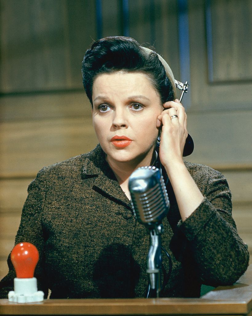 US actress and singer, speaking into a microphone in a publicity still issued for the film, 'Judgement at Nuremberg', USA, 1961