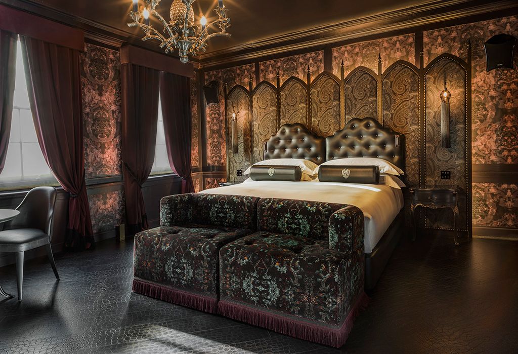 Interior shot of bedroom in apartment at Chateau Denmark hotel, Soho, London