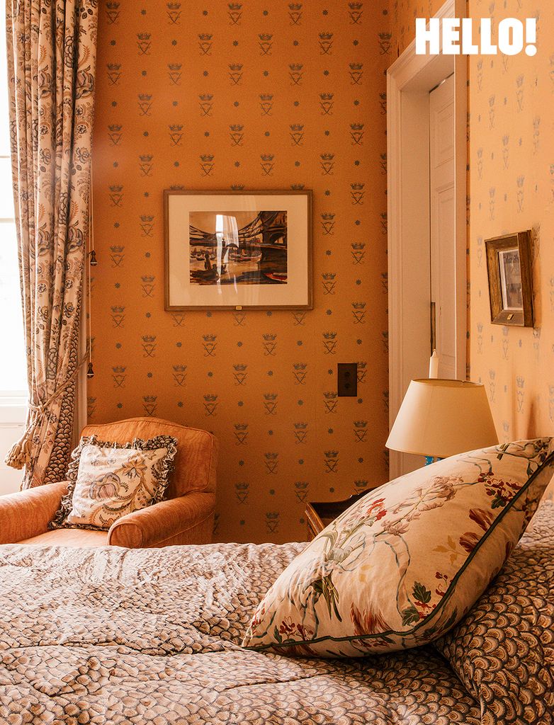 An orange-walled bedroom at Buscot Park