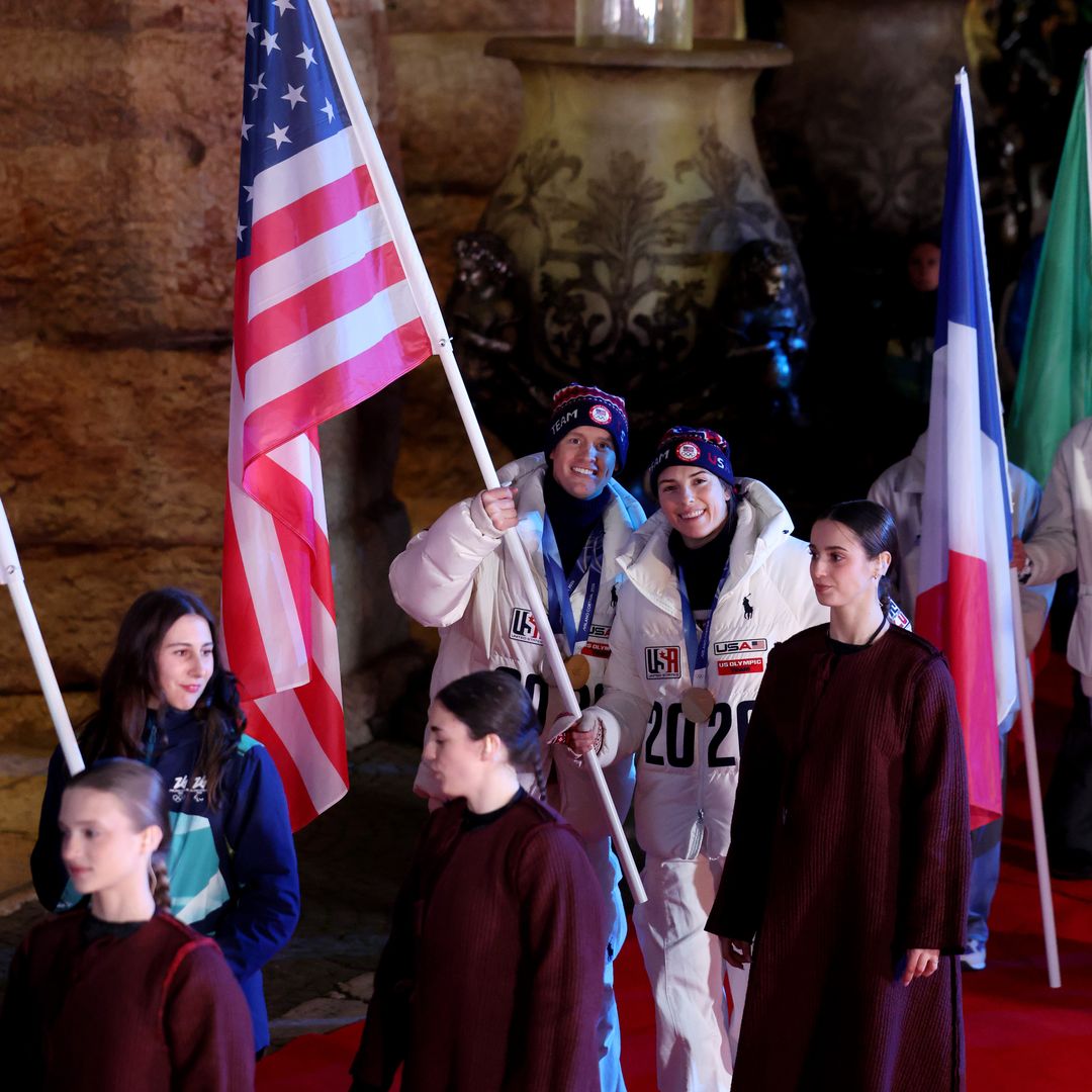 Flagbearers Hilary Knight and Evan Bates of Team United States pose for a photo during the Milano Cortina 2026 Winter Olympics Closing Ceremony on day sixteen of the Milano Cortina 2026 Winter Olympic games at Verona Olympic Arena on February 22, 2026 in Verona, Italy.