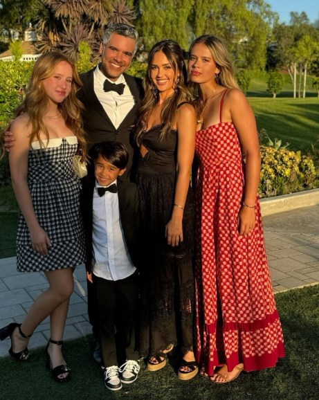 Jessica Alba with her daughters and ex-Cash in dresses smiling 