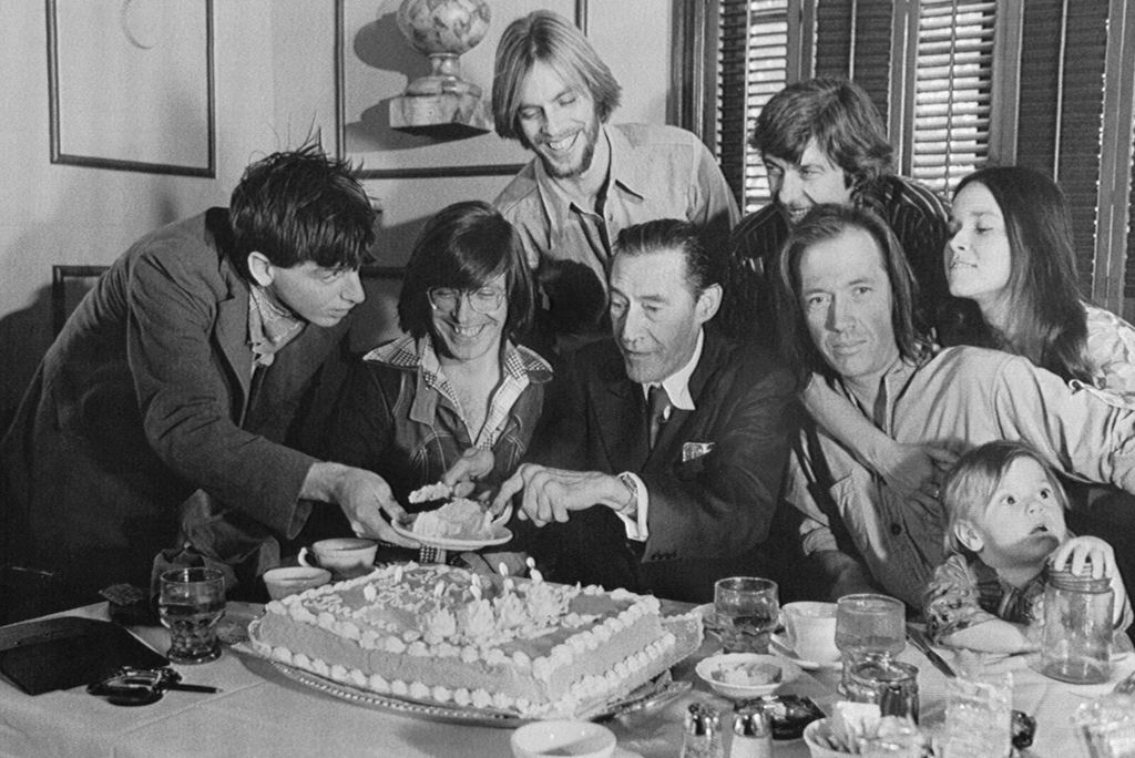 John Carradine (center), holds a reunion with his family to celebrate his 68th birthday. Marking the second time in the family history that the clan has gathered are left to right: Robert Carradine, 19; Christopher Carradine, 26; Keith Carradine, 24; John Carradine; Bruce Carradine (in striped shirt); David Carradine; Barbara (Hershey) Seagull; and David and Barbara's child, Tom Carradine
