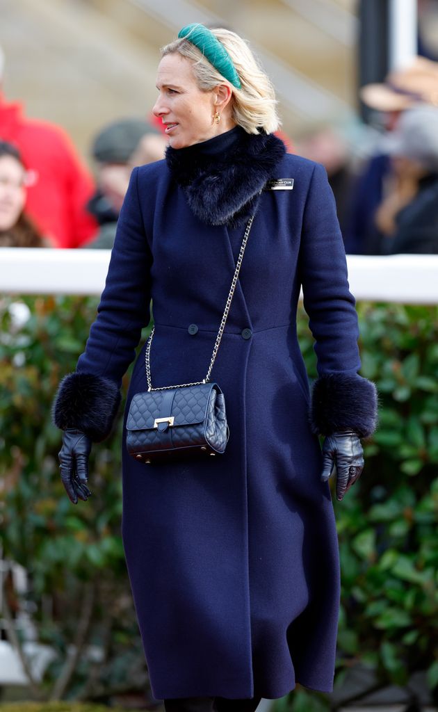 Zara looking to left in navy coat