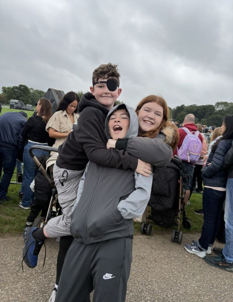 Jack wearing eye patch  outside with sister and brother