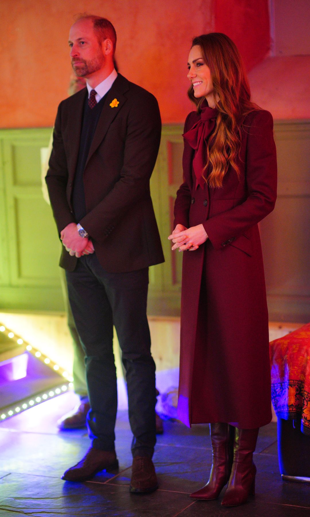 Prince William and Kate Middleton watching a choir perform