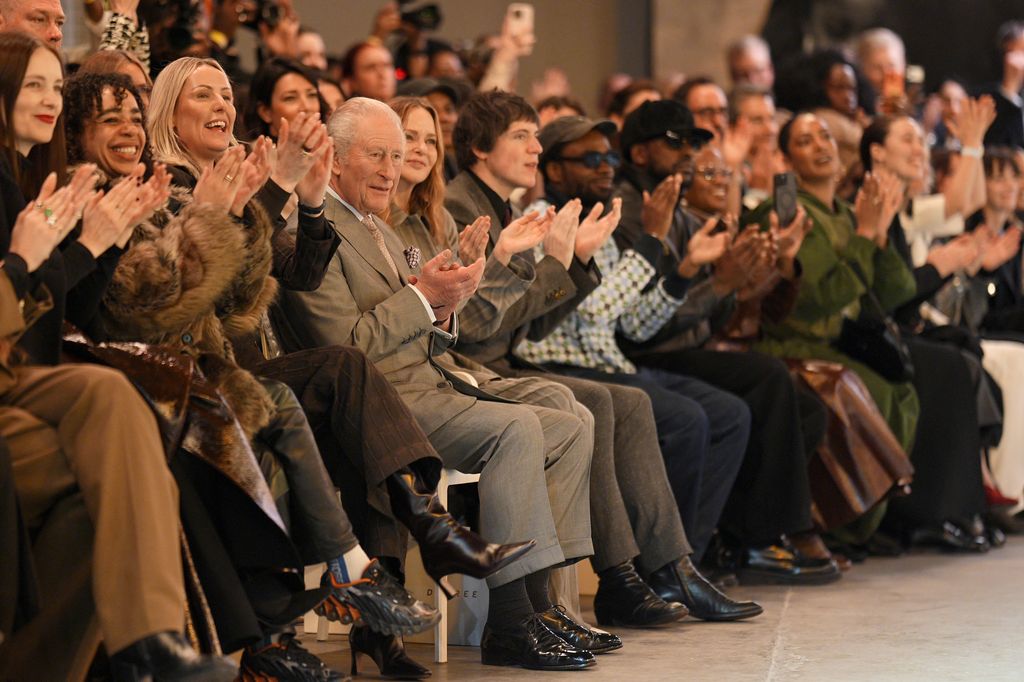 A photo of King Charles sitting FROW at London Fashion Week