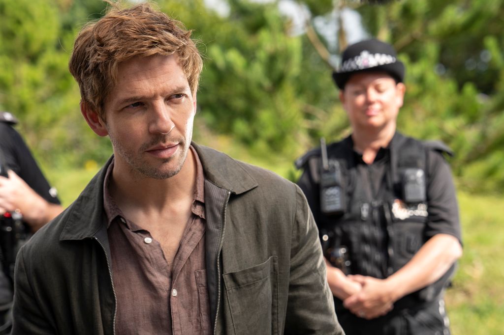 close-up of man standing in front of police officer