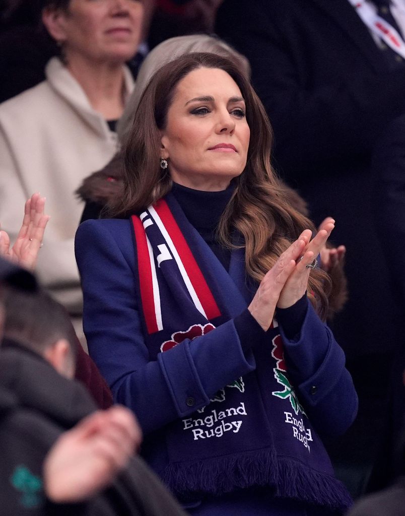 Kate Middleton applauding while looking unhappy