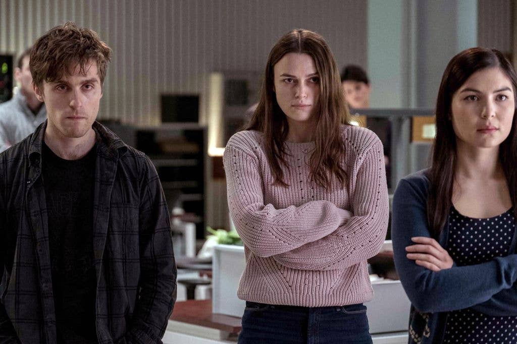 Keira Knighley and a man and a woman in a still image from Official Secrets