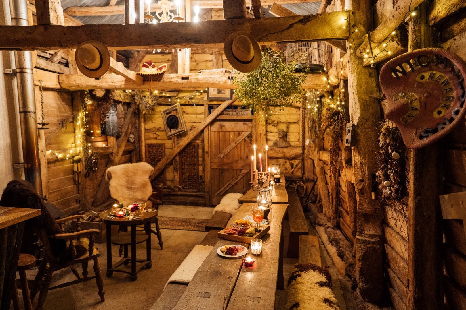 inside barn, fairly lights, table