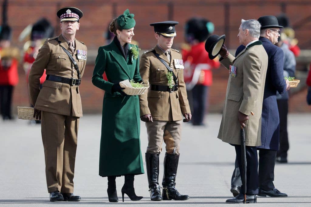 The Princess of Wales presenting traditional sprigs of shamrock alongside officers