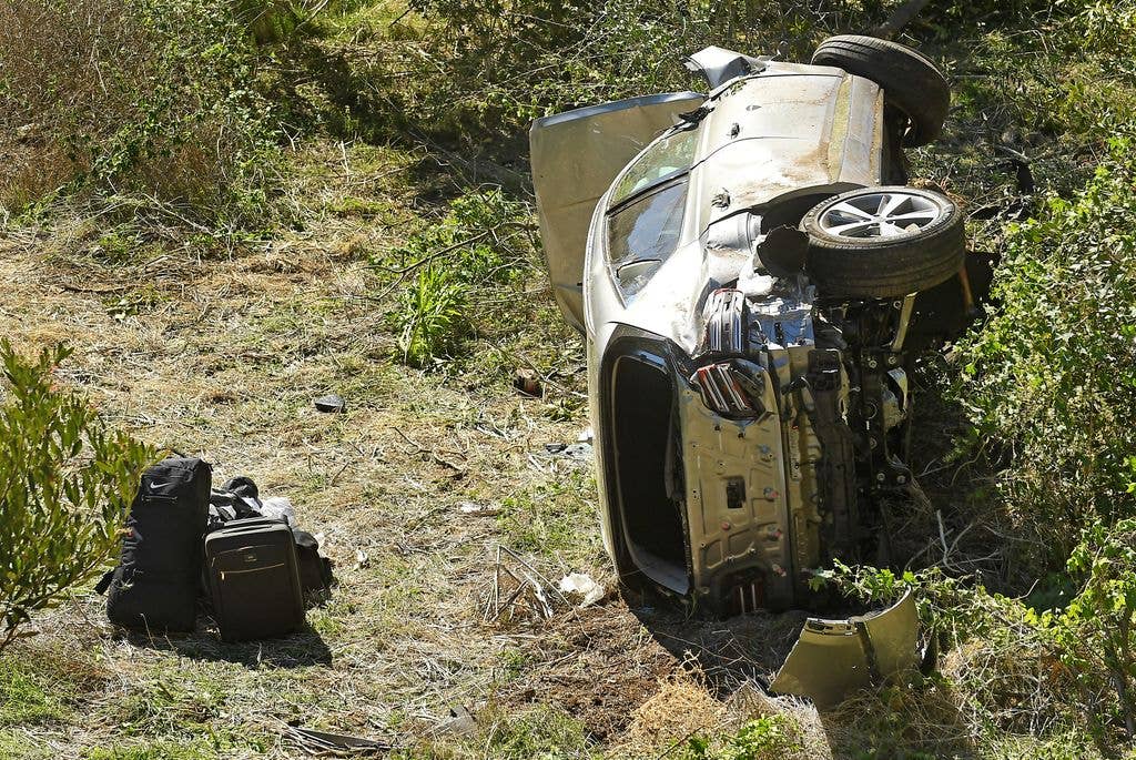 County Sheriff's officers investigate an accident involving famous golfer Tiger Woods along Hawthorne Blvd. in Ranch Paos Verdes Tuesday. (Wally Skalij/Los Angeles Times via Getty Images)