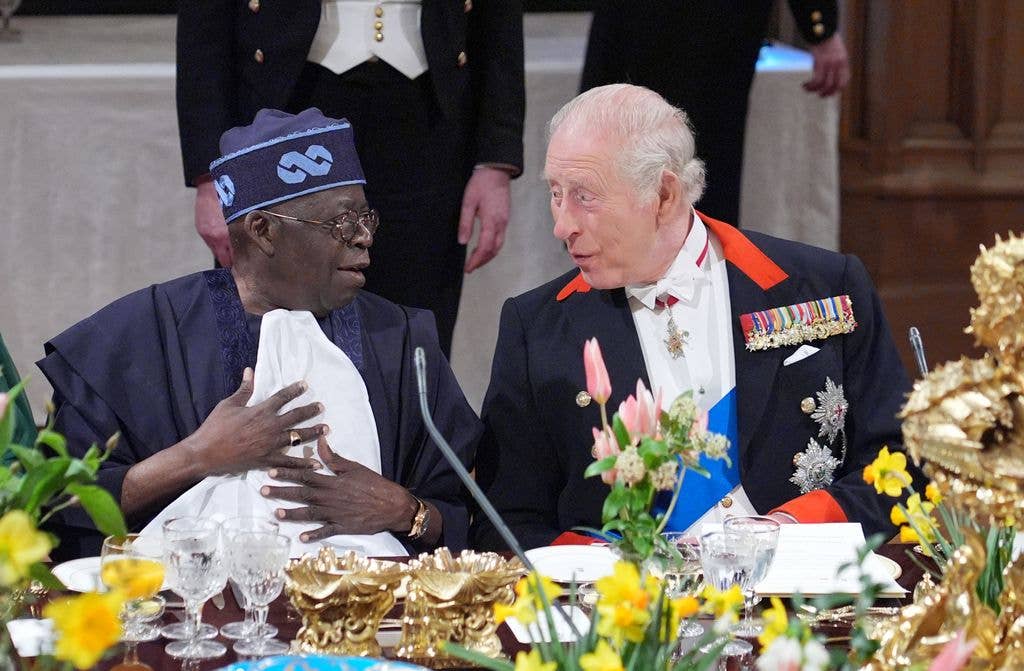 Bola Ahmed Tinubu and King Charles talking at a State Banquet