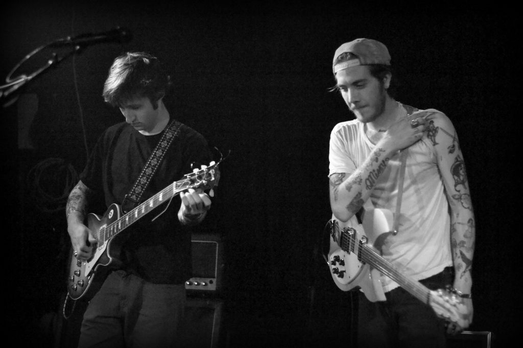 Guitarists Jack Byrne and Malcolm Ford of the rock and roll band "The Dough Rollers" perform onstage at the Viper Room on June 7, 2013 in Los Angeles, California