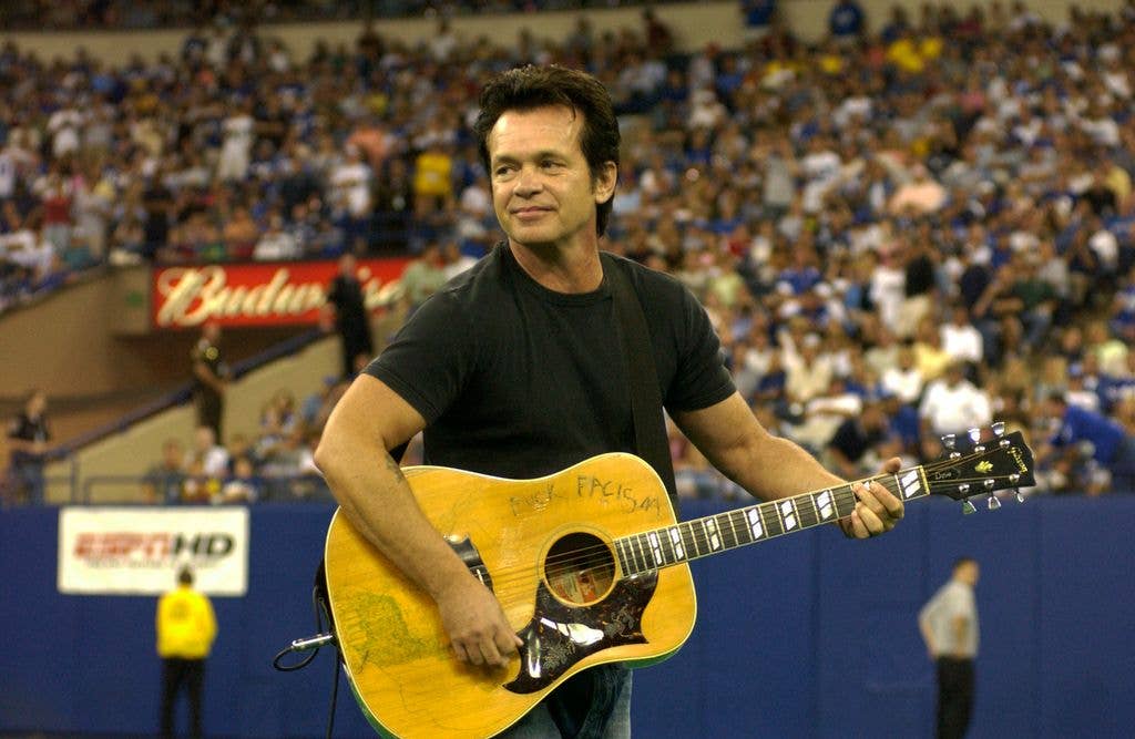 John Mellencamp performs at halftime of the New York Jets vs Indianapolis Colts game at the RCA Dome on August 21, 2004 in Indianapolis, Indiana.