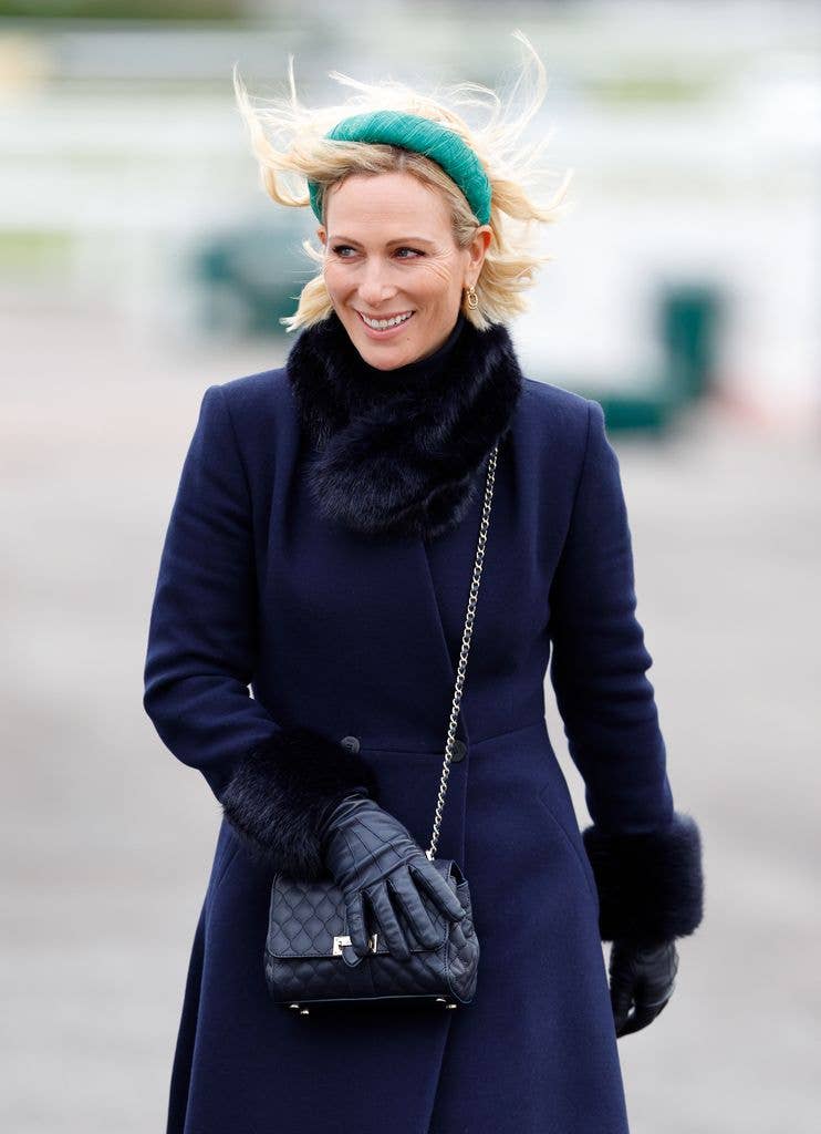 zara in navy coat and teal headband