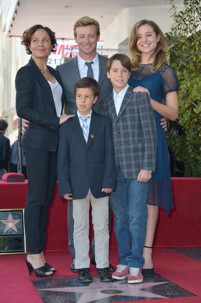 Simon Baker stands with his family on the Hollywood Walk of Fame.