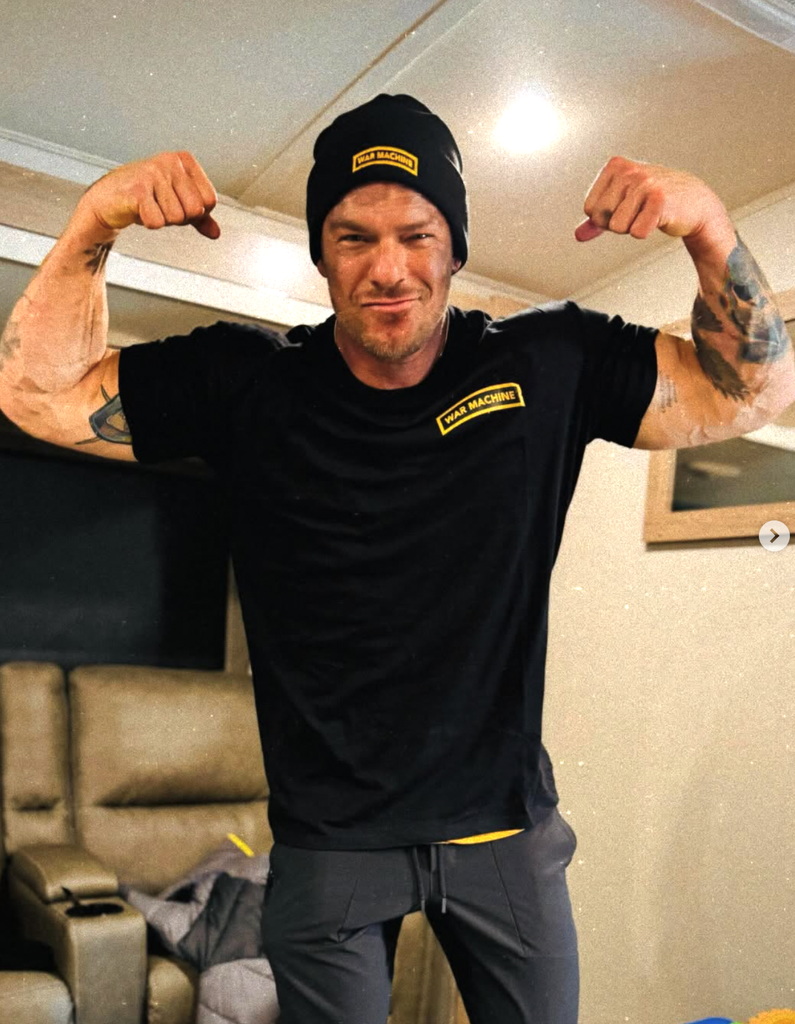 Alan flexing his muscles