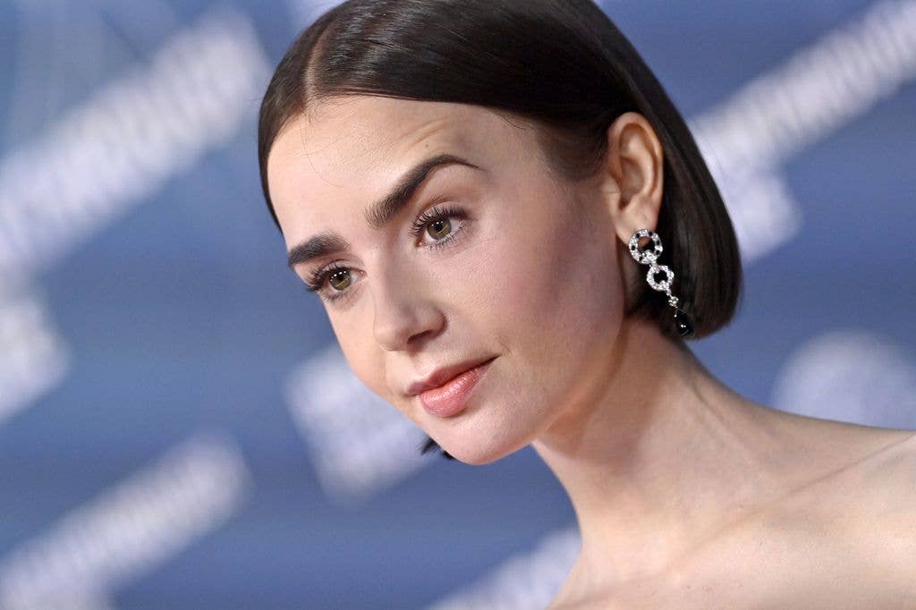 close up of lily collins with bold eyebrows and chic bob