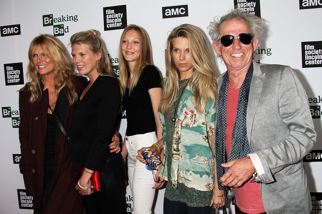 Ella (centre, in 2013) has spoken about her famous grandfather (far right)