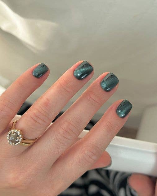 Short cat-eye manicure with a velvet-effect magnetic finish in a deep, sophisticated brown tone.